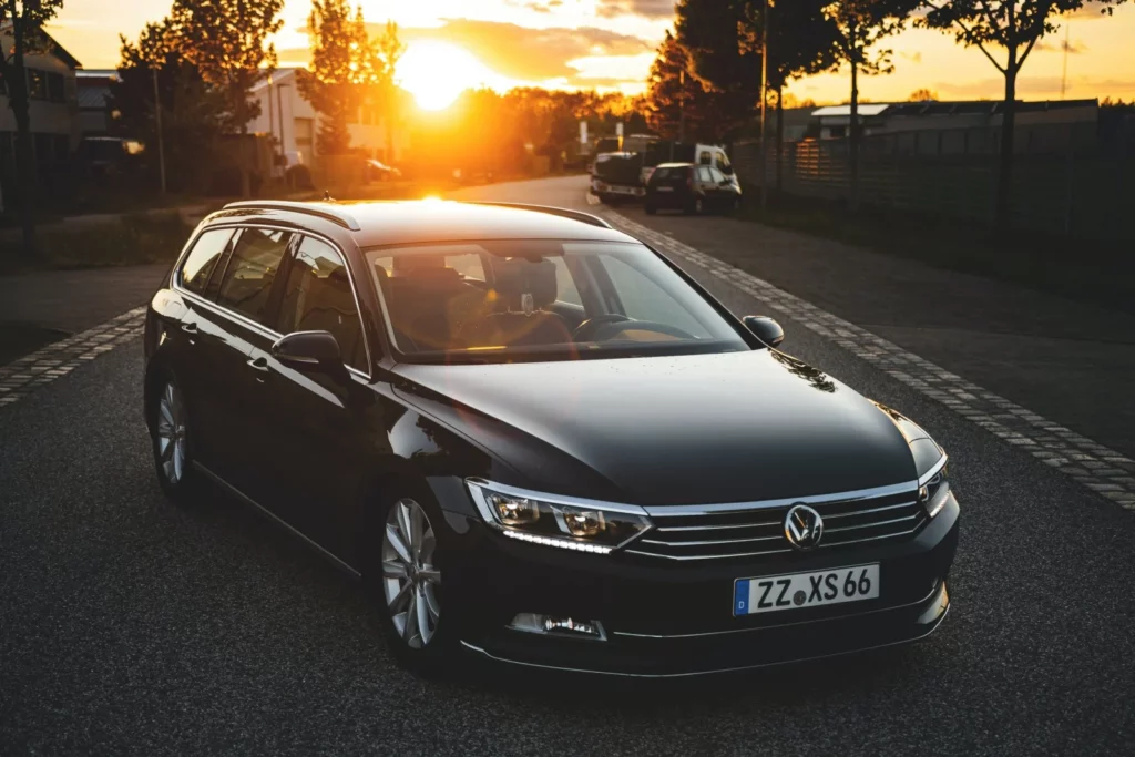 Stunning sunset view with a German car, representing the beauty and allure of imported German automobiles.