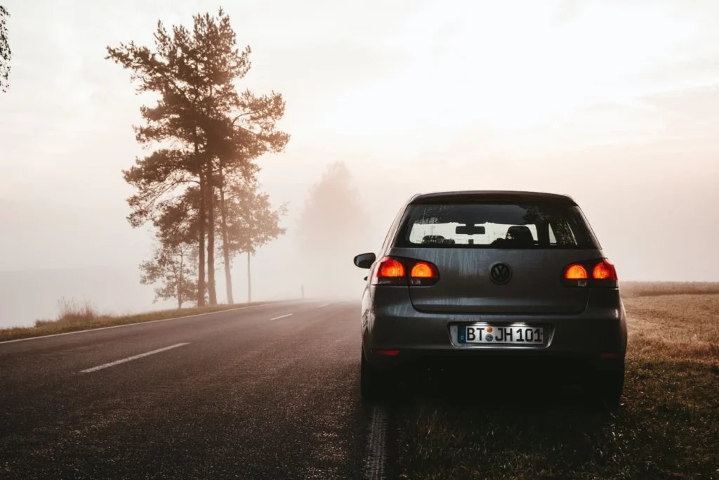 German car in the fog, evoking a sense of mystery and ambiance, capturing the allure of imported German automobiles.